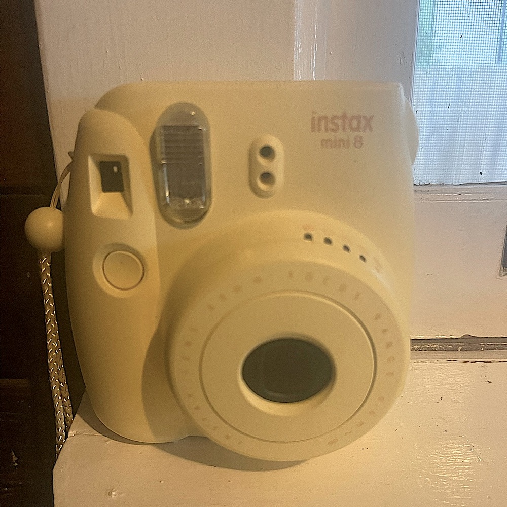 Yellow Instax mini 8 poloroid camera